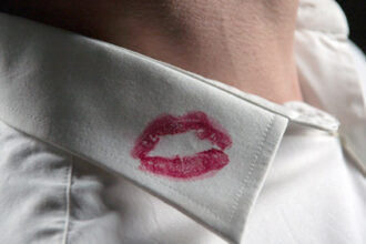 man with lipstick on shirt