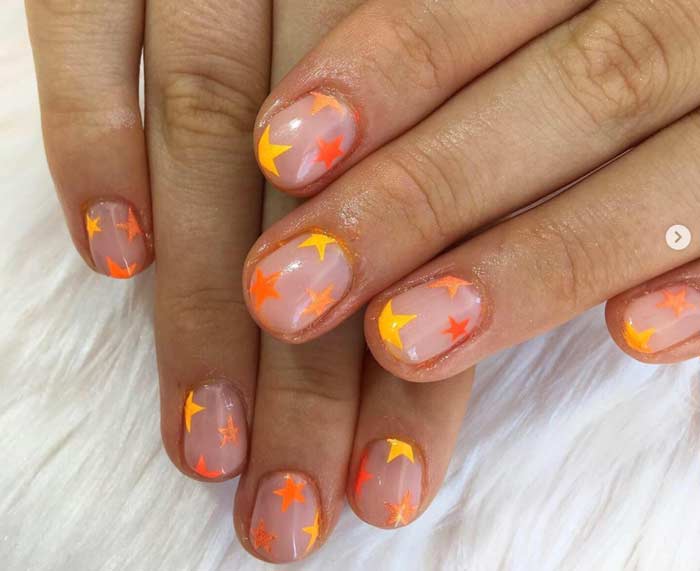 Manicure fluo con fiamma arancione