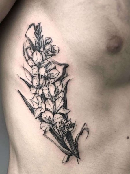 Tatuaggio con fiore gladiolo