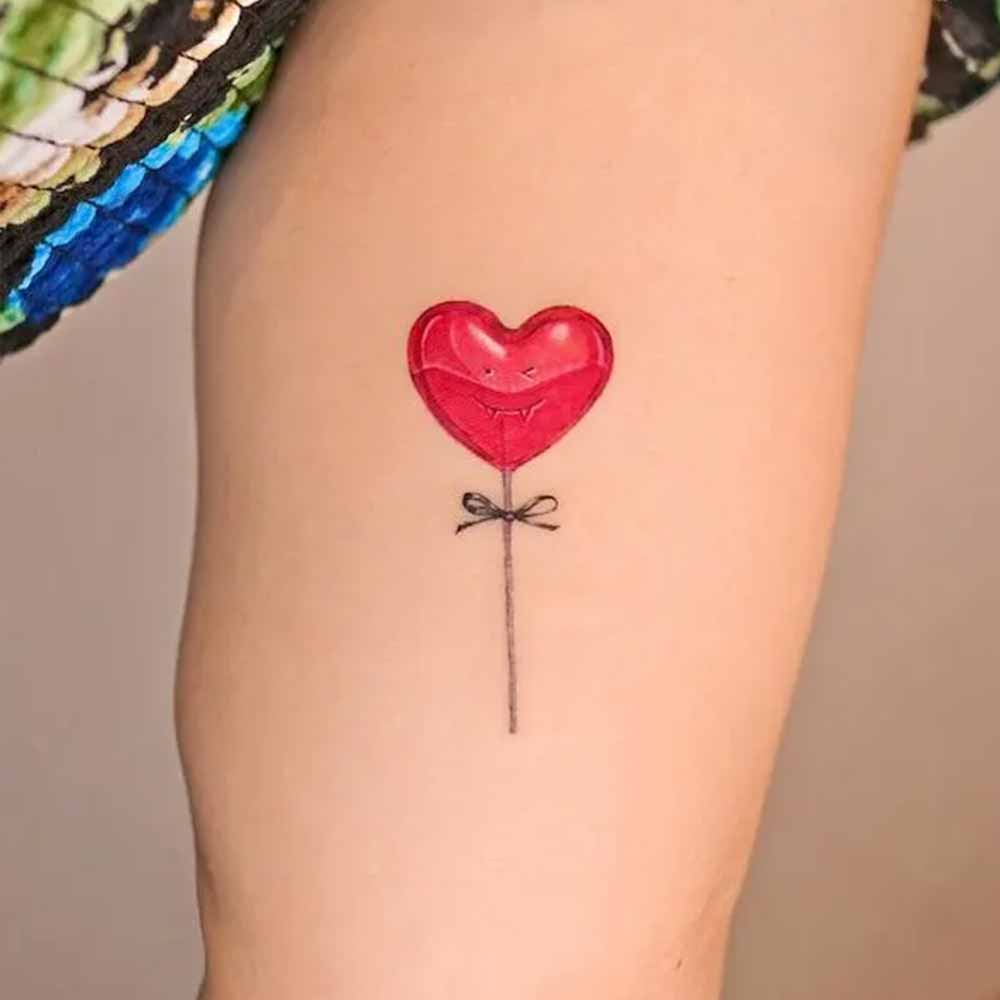 tatuaggio cuore caramella con stecchino tatuaggio cuore caramella con stecchino